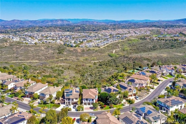 aerial view featuring a mountain view and a residential view