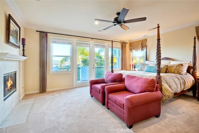 bedroom with a fireplace with flush hearth, access to outside, french doors, crown molding, and light colored carpet