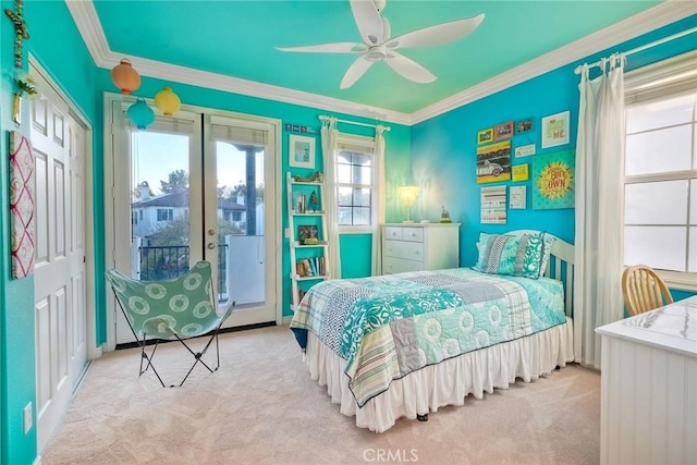 carpeted bedroom with crown molding and ceiling fan