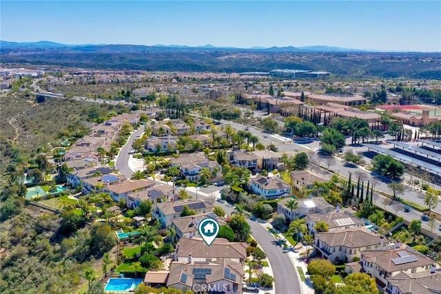 drone / aerial view with a residential view and a mountain view