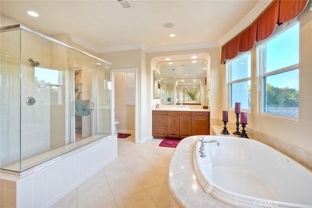 full bathroom with vanity, crown molding, a bath, and a shower stall