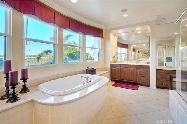 bathroom featuring ornamental molding, tile patterned flooring, walk in shower, a bath, and vanity