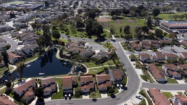 birds eye view of property featuring a residential view and a water view