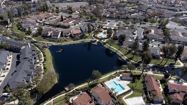 bird's eye view featuring a residential view and a water view