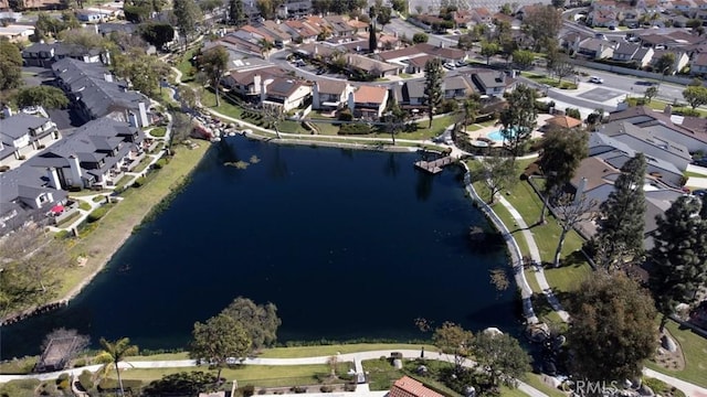 drone / aerial view with a residential view and a water view