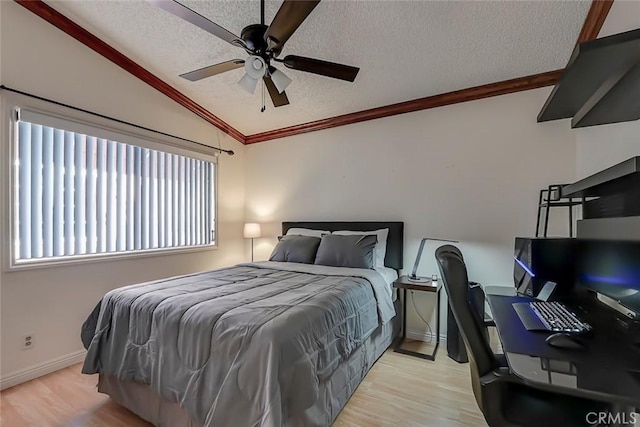 bedroom with light wood finished floors, ornamental molding, a textured ceiling, and vaulted ceiling