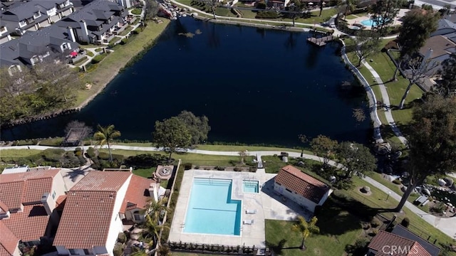 birds eye view of property with a water view