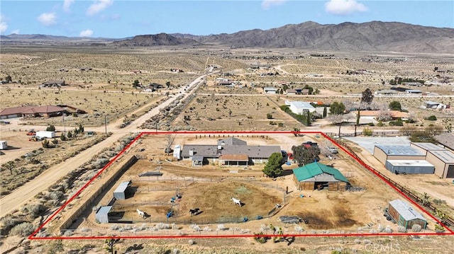 bird's eye view with view of desert, a rural view, and a mountain view