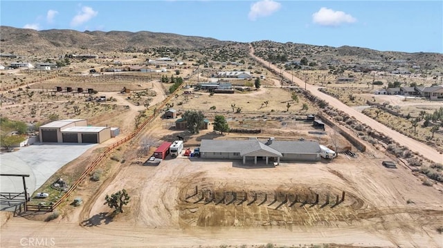 bird's eye view featuring a rural view, a mountain view, and a desert view