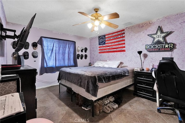 bedroom with ceiling fan, a textured ceiling, wallpapered walls, and baseboards