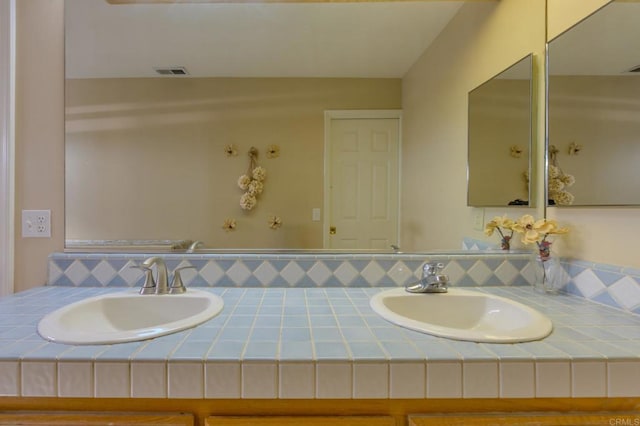 22633 Inspiration Pt, Canyon Lake, CA 92587 - bathroom with double vanity, visible vents, and a sink