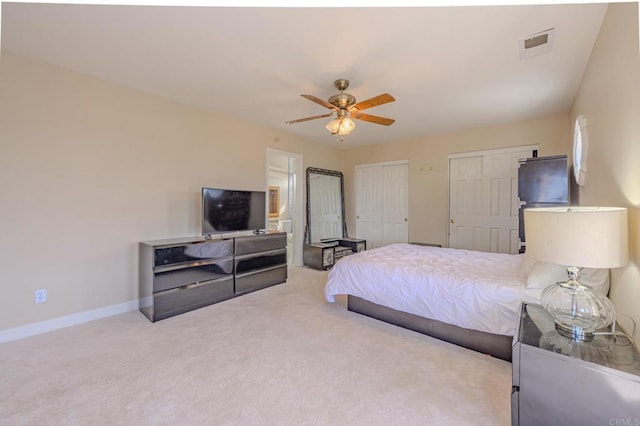 22633 Inspiration Pt, Canyon Lake, CA 92587 - carpeted bedroom with ceiling fan, visible vents, multiple closets, and baseboards