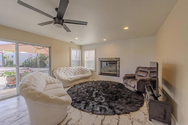 22633 Inspiration Pt, Canyon Lake, CA 92587 - living area with visible vents, recessed lighting, ceiling fan, a glass covered fireplace, and marble finish floor