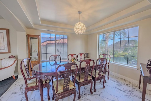 22633 Inspiration Pt, Canyon Lake, CA 92587 - dining space featuring visible vents, a raised ceiling, marble finish floor, baseboards, and a chandelier