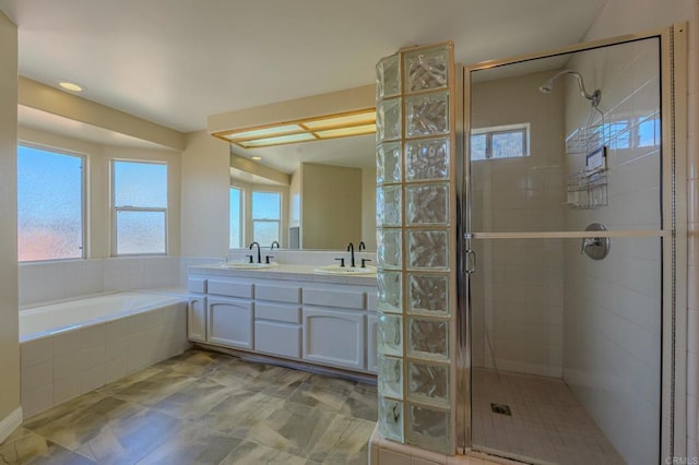 22633 Inspiration Pt, Canyon Lake, CA 92587 - full bath featuring a sink, a garden tub, double vanity, and a shower stall