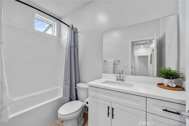 bathroom featuring vanity, toilet, and shower / bath combo