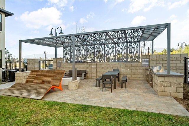 view of patio featuring a grill and exterior kitchen