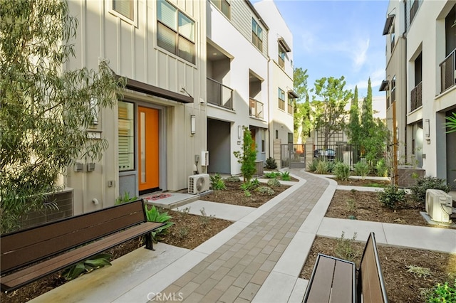 view of property's community featuring a residential view, fence, and ac unit