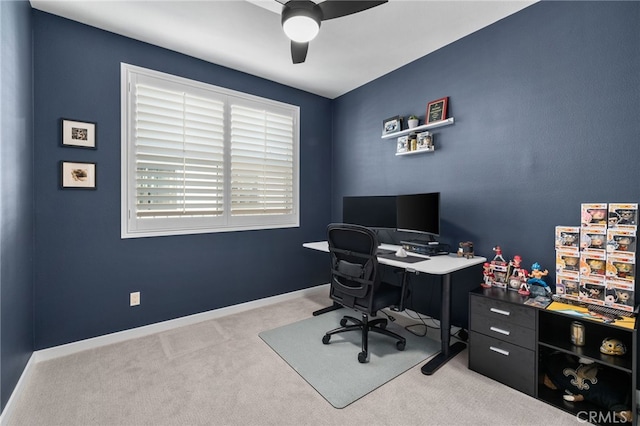 office area with baseboards, ceiling fan, and carpet floors