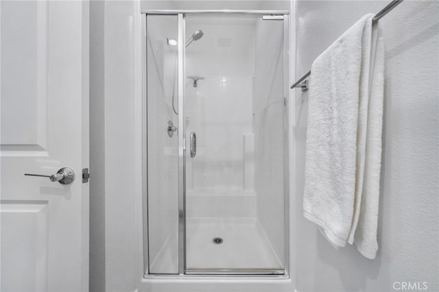 bathroom with a stall shower