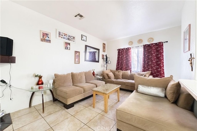 living room with light tile patterned floors and visible vents