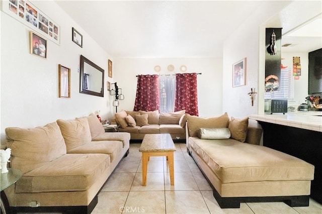 living area featuring light tile patterned flooring