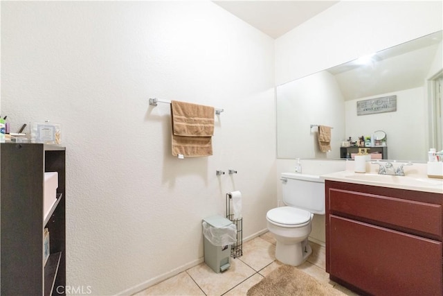 bathroom with tile patterned floors, baseboards, toilet, and vanity