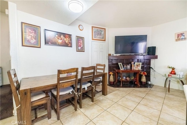 dining space featuring light tile patterned floors