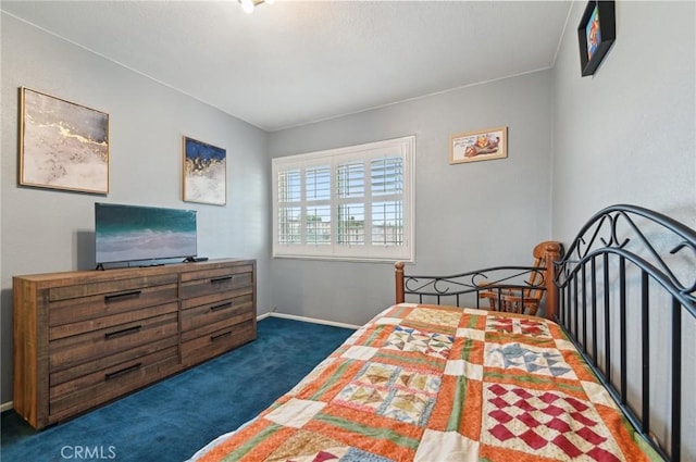 bedroom featuring carpet flooring and baseboards