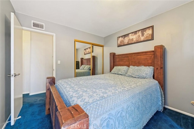 bedroom featuring visible vents, baseboards, a closet, and dark carpet