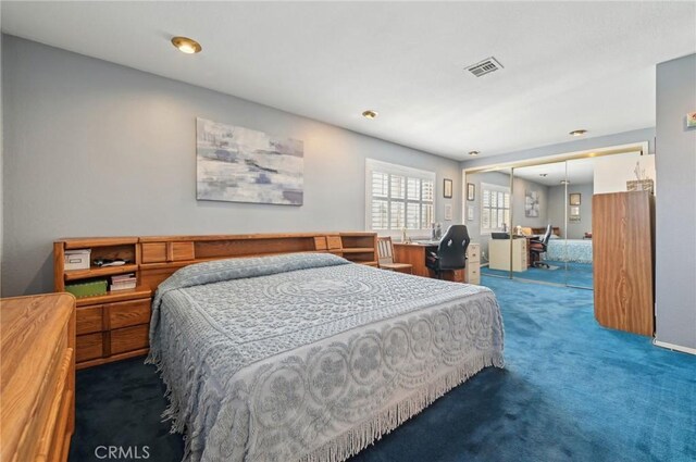 carpeted bedroom with visible vents