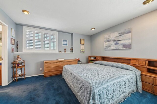 bedroom featuring carpet flooring and baseboards