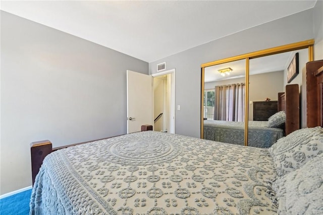 bedroom featuring visible vents and a closet