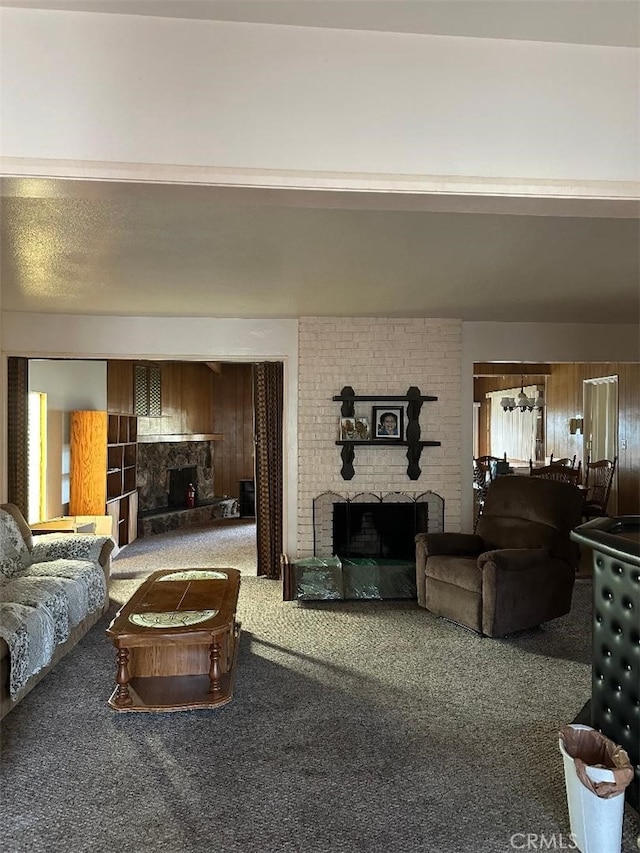 carpeted living area with a brick fireplace