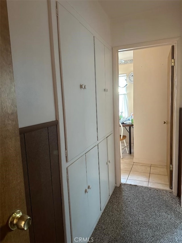 hallway with light tile patterned flooring