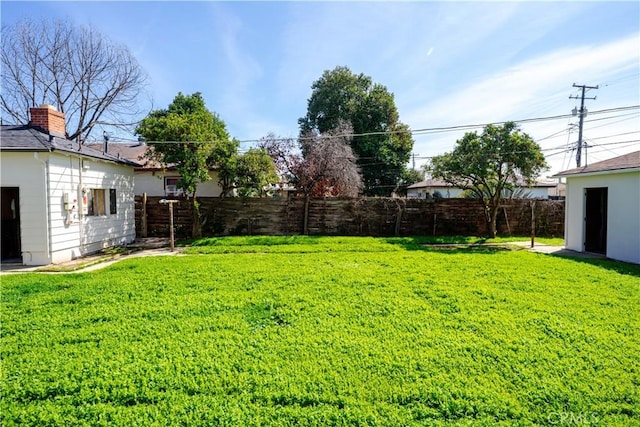 view of yard with fence