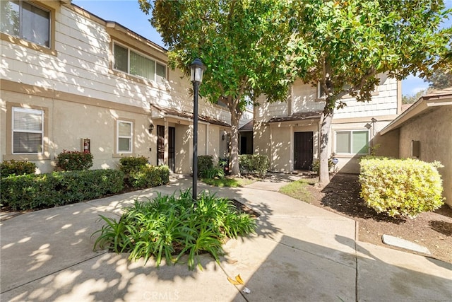 exterior space featuring stucco siding