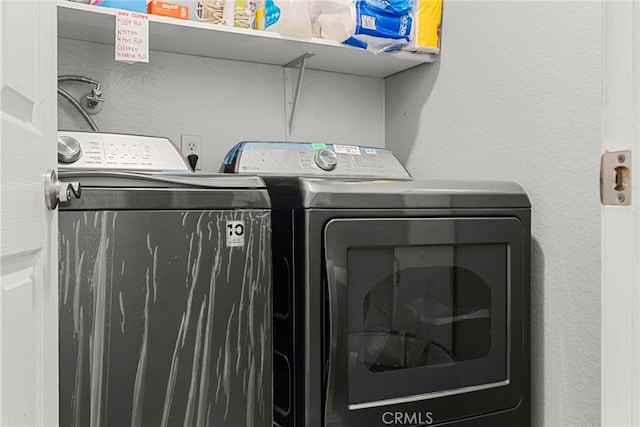 washroom featuring independent washer and dryer