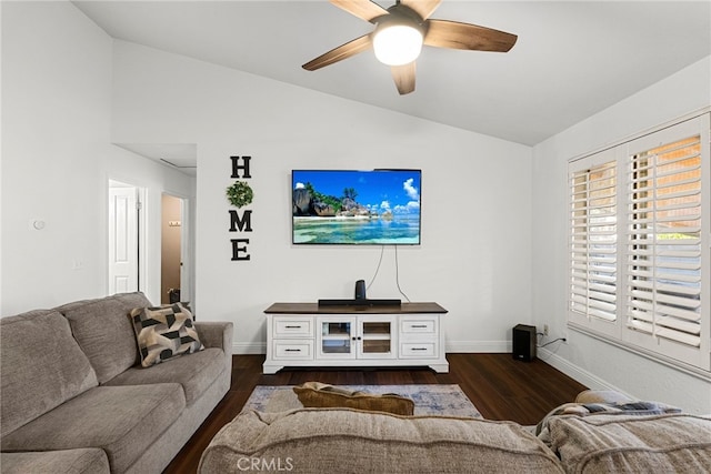 living room with baseboards, lofted ceiling, dark wood-type flooring, and a ceiling fan