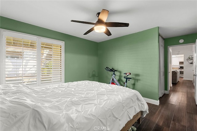 bedroom featuring dark wood-style floors, baseboards, and ceiling fan