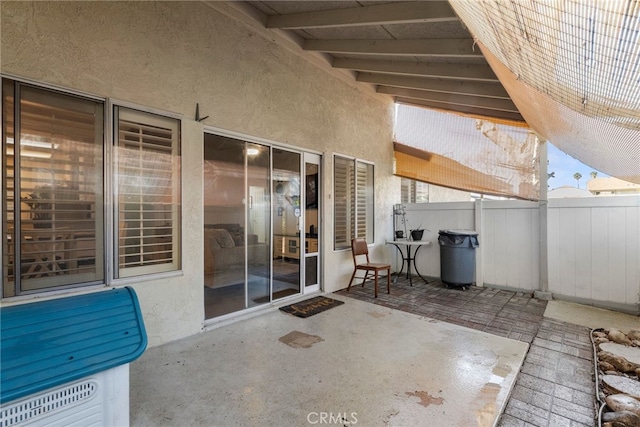 view of patio featuring fence