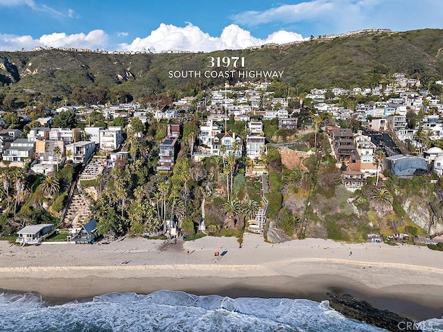 drone / aerial view with a residential view and a water and mountain view