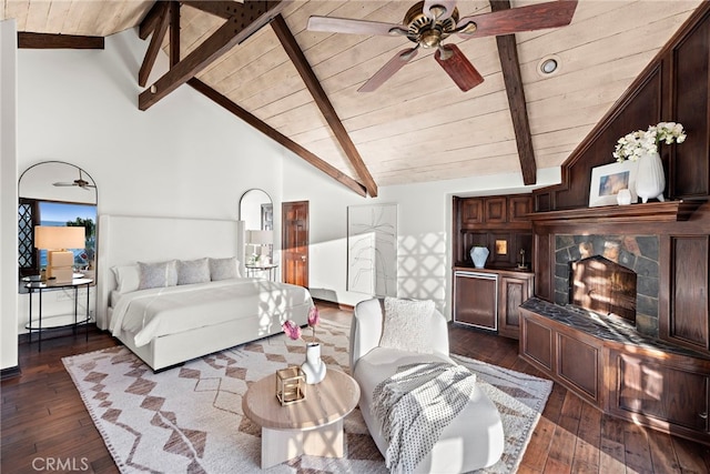 bedroom featuring dark wood-type flooring, wooden ceiling, a tiled fireplace, and baseboards