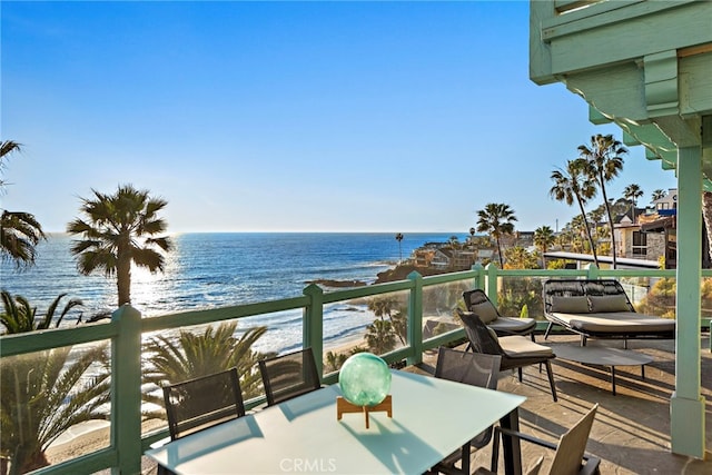 balcony featuring a water view