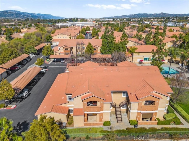 drone / aerial view with a residential view and a mountain view