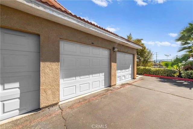 garage featuring fence