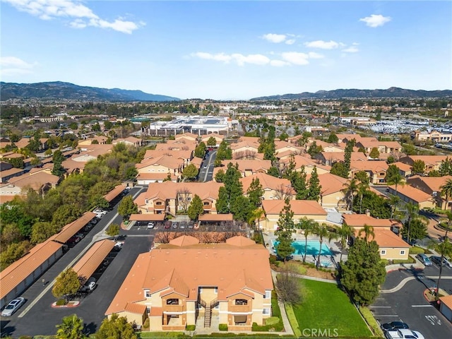 birds eye view of property featuring a mountain view and a residential view