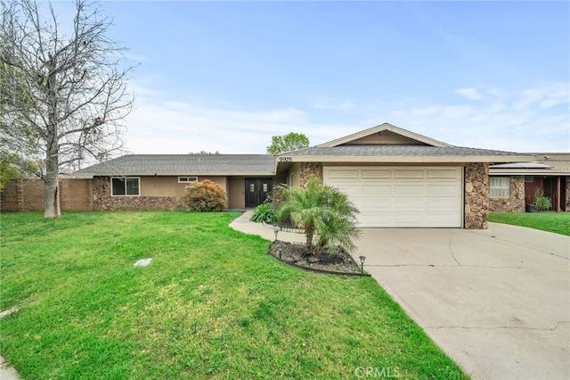 ranch-style home featuring an attached garage, a front yard, stucco siding, stone siding, and driveway