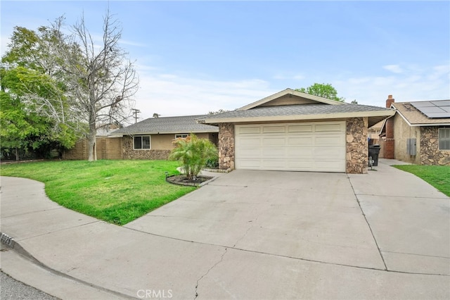 ranch-style home with a garage, stone siding, concrete driveway, and a front yard