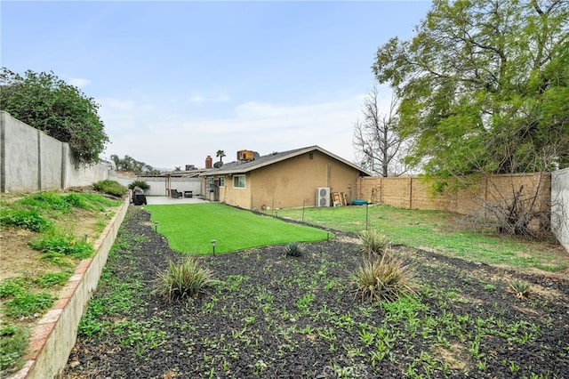 view of yard featuring a patio and a fenced backyard